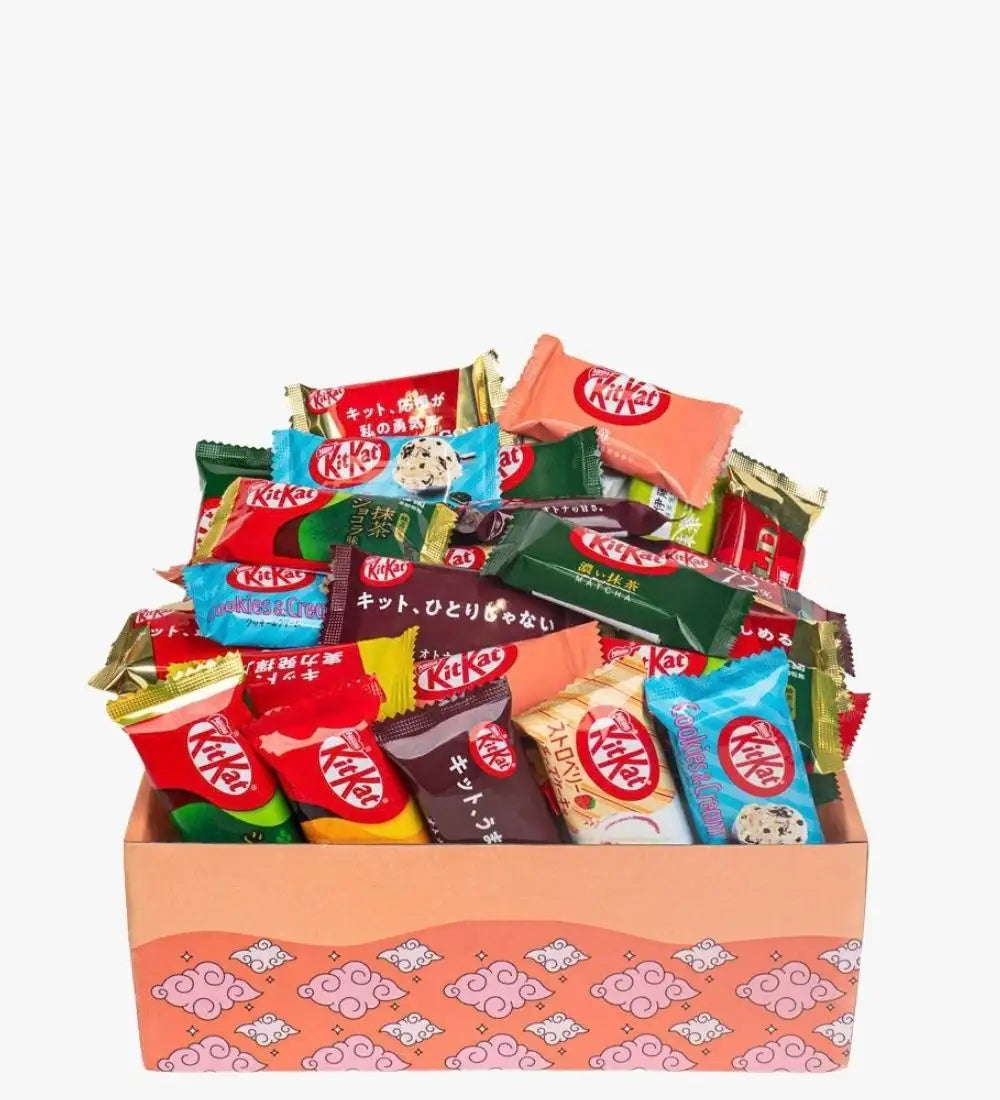 A vibrant assortment of kitkat chocolate bars in assorted flavors and colorful wrappers nestled inside a pink patterned gift box.