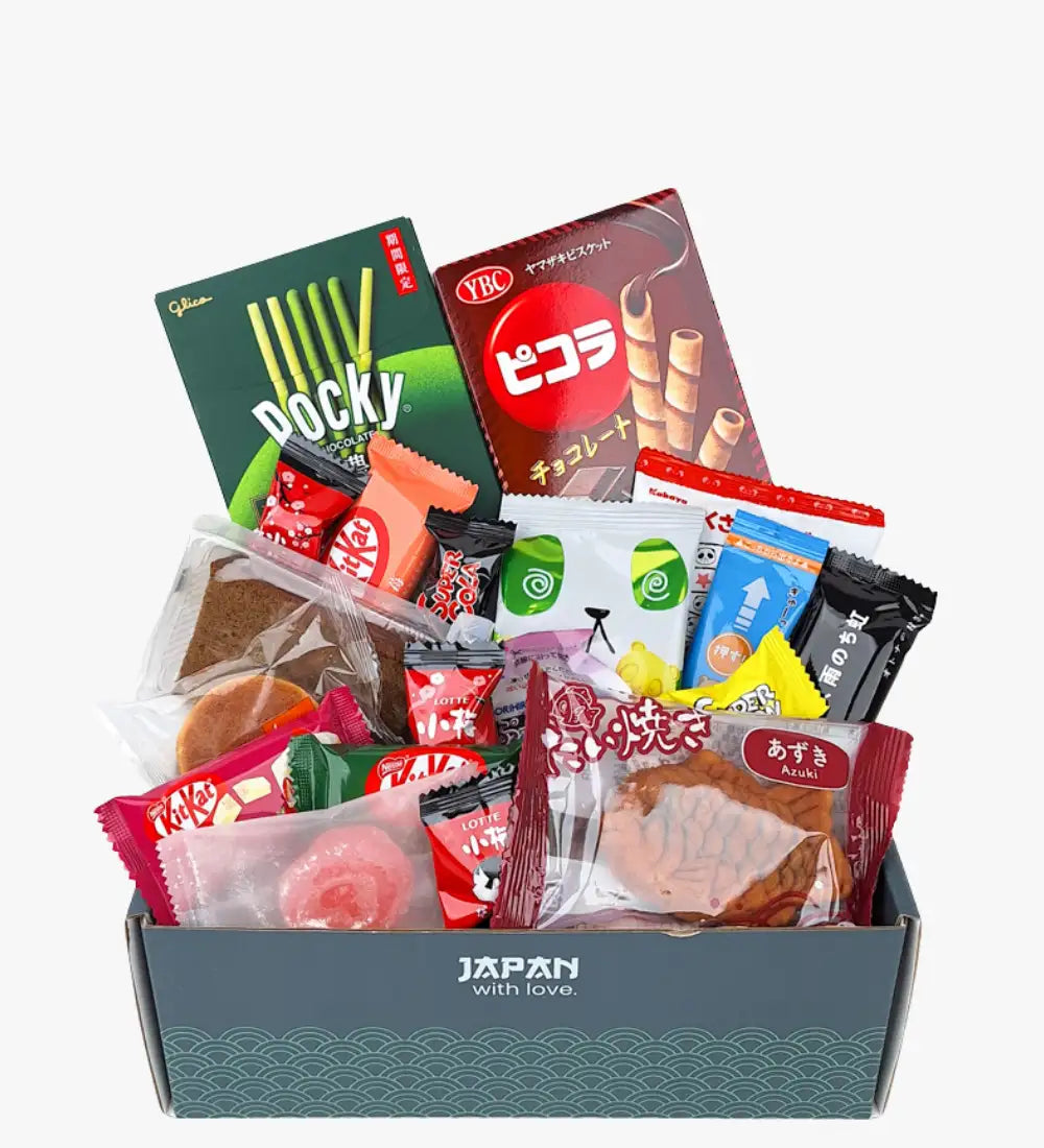 A gray gift box labeled ’japan with love’ filled with assorted japanese snacks including pocky, kitkat, and azuki cookies.