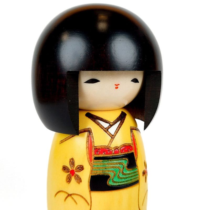 Yellow Kokeshi doll